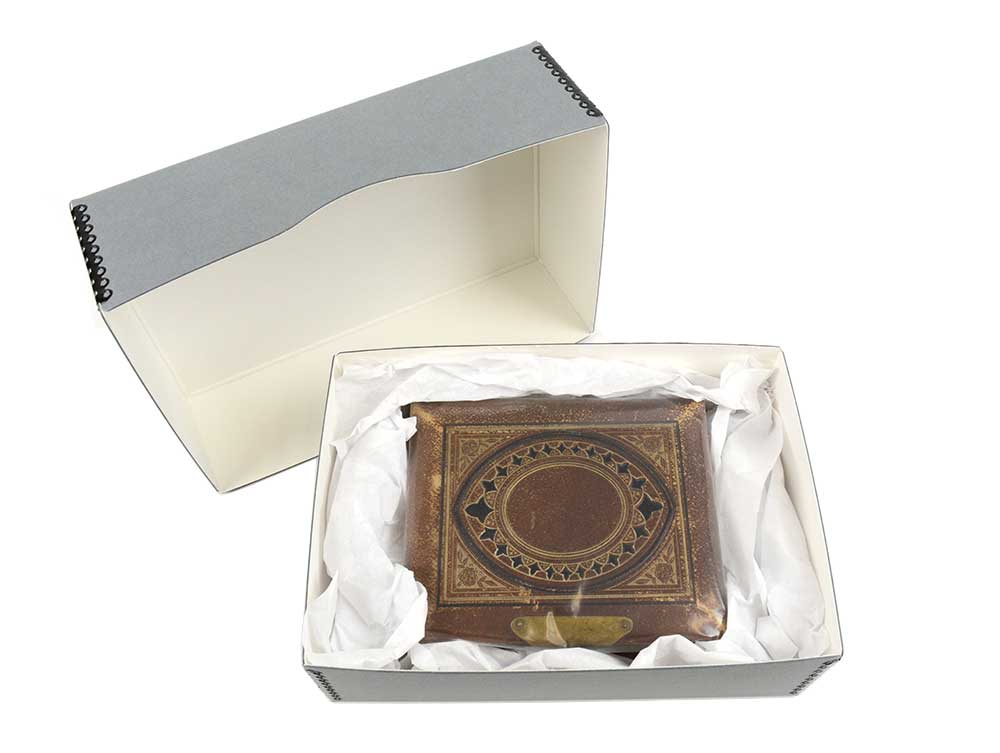 Archival gray Full Top Box made from acid-free materials, holding a large Bible cushioned with acid-free tissue for support