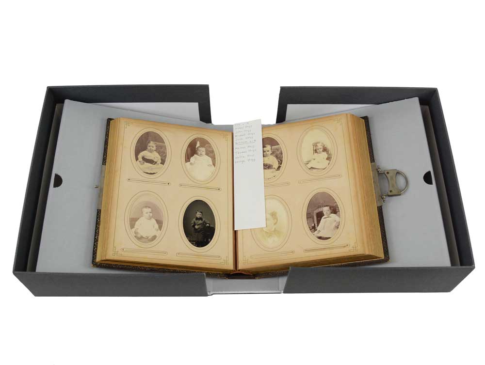 Archival, acid-free paper bookmark in a 19th century photo album used to make notations in pencil about the photographs.