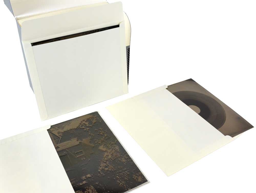 Prints and negatives stored in archival folders inside hinged lid metal edge box