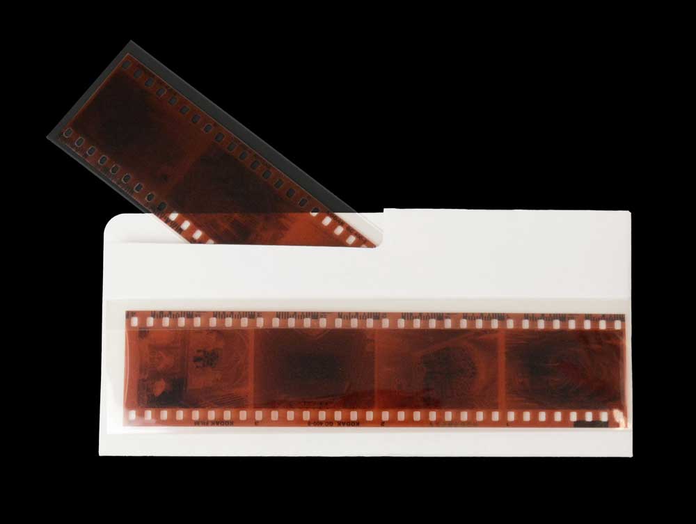 Acid-free archival file folders for organizing and storing film negatives, offering long-term protection against deterioration.