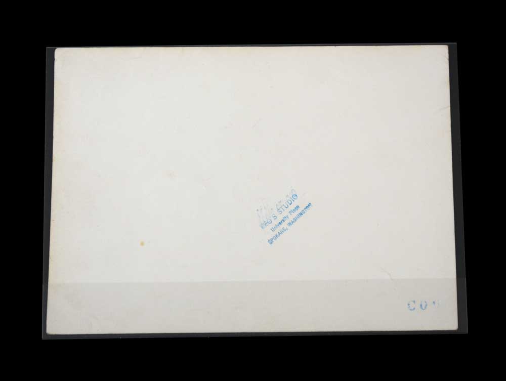 Back view of photo stored in a side loading print sleeve to show the flap