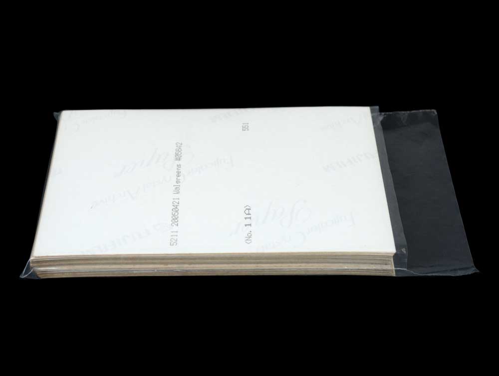 Polyethylene bag storing a stack of 4 x 6 photos