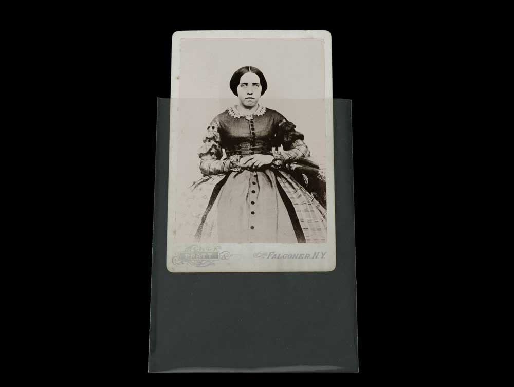 Cabinet card photo half inserted into a 3-Sided Sleeve to illustrate clarity of the archival sleeve