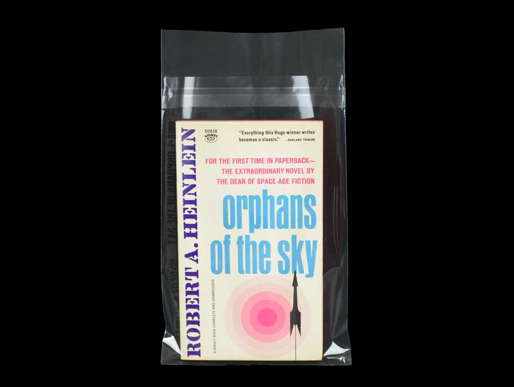 Acid-free Crystal Clear Bags shown with a vintage book, perfect for protecting artifacts from dust and moisture for archival storage and presentation.