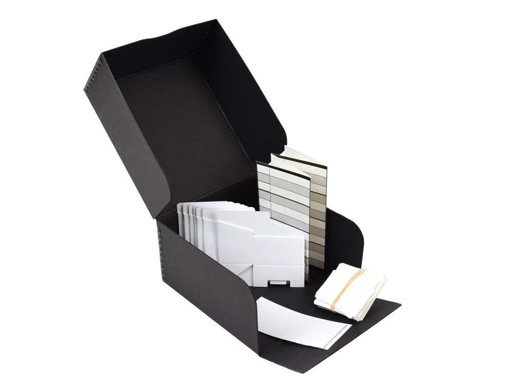 USB/Memory Card Storage Kit with acid-free archival box, indexing card, and labels, designed to organize and protect digital storage devices.