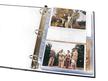 Open archival storage binder showing photographs in sheet protectors. 3-ring binder uses acid free materials. thumbnail